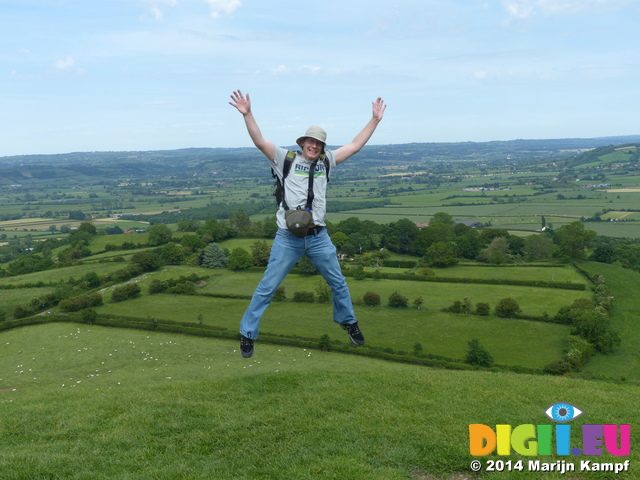 FZ005535 Marijn jumping at Glastonbury tor